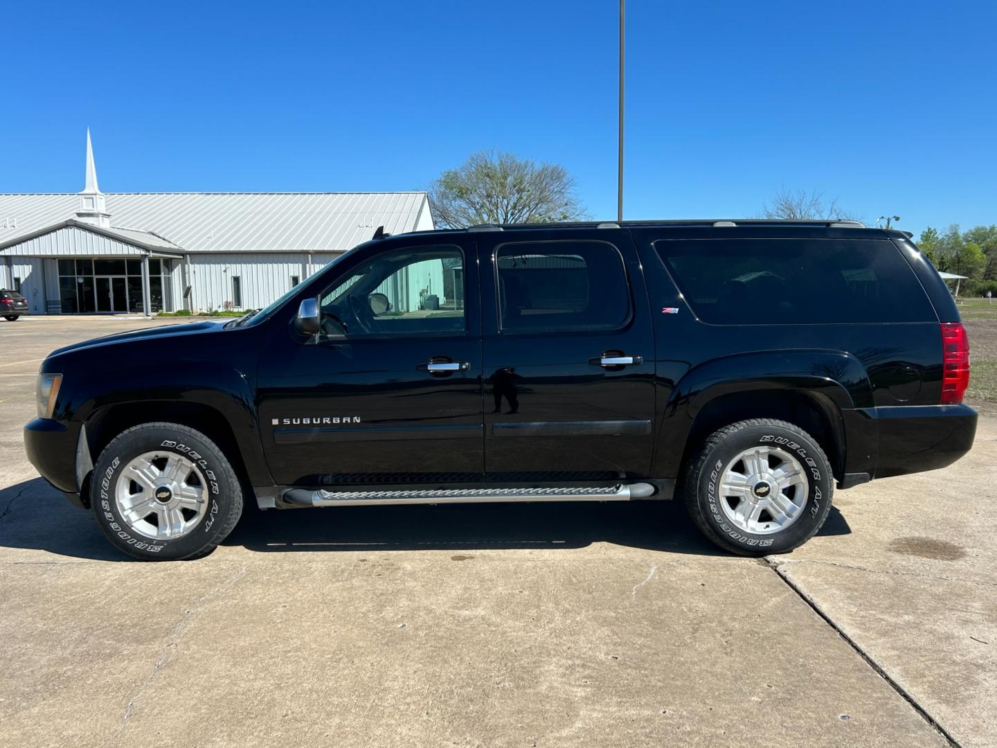 2007 BLACK /BLACK Chevrolet Suburban LS 1500 4WD (3GNFK16377G) with an 5.3L V8 OHV 16V FFV engine, 4-Speed Automatic Overdrive transmission, located at 17760 Hwy 62, Morris, OK, 74445, (918) 733-4887, 35.609104, -95.877060 - 2007 CHEVROLET SUBURBAN HAS 5.3L V8 ENGINE. THIS SUV FEATURES KEYLESS REMOTE ENTRY, POWER SEATS, POWER LOCKS, POWER WINDOWS, POWER WINDOWS, POWER ADJUSTABLE FOOT PEDAL, AMFM STEREO, XM RADIO, AUX PORT, NAVIGATION, BACKUP CAMERA, MULIT-FUNCTION STEERING WHEEL CONTROLS, CRUISE CONTROL, DUAL CLIMATE CO - Photo#7